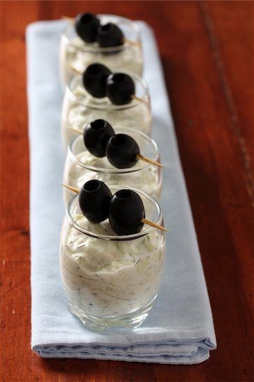 a fancy plate of Anatolian yogurt cups with olives that can be enjoyed with the Turkish delicacy