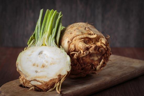 A chopped celeriac root is ready to be hollowed out and prepared.