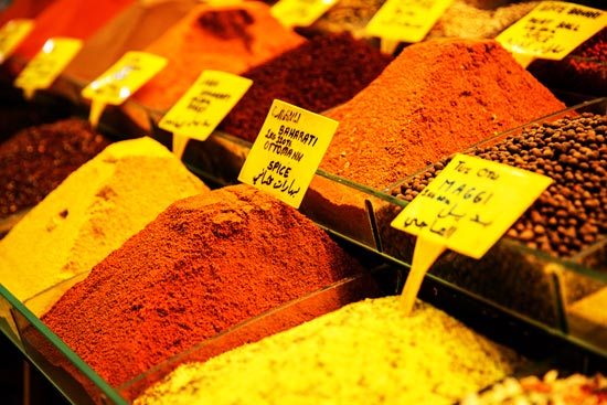 A variety of fresh spices on display and ready for inclusion within a rich Turkish pastry.